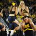 Michigan cheerleaders perform for the crowd in the second half at Crisler Center on Sunday, Jan. 6. Michigan beat Iowa 95-67 in the Big Ten home opener. Melanie Maxwell I AnnArbor.com